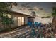 Serene backyard patio with dining set, offering a private outdoor space for entertaining and relaxation at 1807 E Jamaica Ave, Mesa, AZ 85204