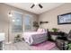 Bright bedroom features bright, natural light, comfortable furnishings and stylish decor at 18334 W Marshall Ln, Surprise, AZ 85388