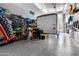 Epoxy-floored garage with built-in shelving and storage racks, perfect for organizing tools and equipment at 18334 W Marshall Ln, Surprise, AZ 85388