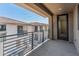 This covered balcony features modern metal railings overlooking other homes in the community at 2121 W Sonoran Desert Dr # 14, Phoenix, AZ 85085
