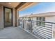 Relax on this covered balcony featuring stylish metal railings with views of the community at 2121 W Sonoran Desert Dr # 14, Phoenix, AZ 85085