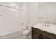 Bathroom features shower and tub, white tile, and vanity with modern fixtures at 2121 W Sonoran Desert Dr # 14, Phoenix, AZ 85085