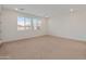 Spacious bedroom with carpet, recessed lighting and large windows providing natural light at 2121 W Sonoran Desert Dr # 14, Phoenix, AZ 85085