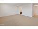 Large bedroom features carpeted floors, neutral walls, and access to adjacent rooms at 2121 W Sonoran Desert Dr # 14, Phoenix, AZ 85085