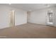 Bedroom with carpet, white walls, and multiple doorways leading to other rooms at 2121 W Sonoran Desert Dr # 14, Phoenix, AZ 85085