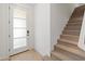 Bright entryway features a tiled floor, white trim door with glass, and a carpeted staircase at 2121 W Sonoran Desert Dr # 14, Phoenix, AZ 85085
