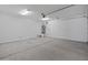 Spacious two car garage with concrete flooring and a water heater at 2121 W Sonoran Desert Dr # 14, Phoenix, AZ 85085