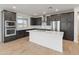 Stunning kitchen with dark wood cabinetry, a stainless-steel hood, a white island, and pristine white subway tile at 2121 W Sonoran Desert Dr # 14, Phoenix, AZ 85085