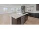 Bright kitchen boasting stainless steel appliances, dark wood cabinetry, white countertops, and light wood-look flooring at 2121 W Sonoran Desert Dr # 14, Phoenix, AZ 85085