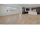 Bright living room featuring tile floors, large windows, and open access to the modern kitchen at 2121 W Sonoran Desert Dr # 14, Phoenix, AZ 85085