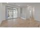 Bright living area with sleek wood-look floors, white trim, large sliding doors to a balcony at 2121 W Sonoran Desert Dr # 14, Phoenix, AZ 85085