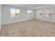 Spacious living room with tile flooring, ample natural light from large windows, and a neutral color palette at 2121 W Sonoran Desert Dr # 14, Phoenix, AZ 85085