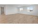 Open-concept living room with tile flooring, recessed lighting, and large windows for natural light at 2121 W Sonoran Desert Dr # 14, Phoenix, AZ 85085