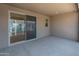 The covered patio includes a sliding glass door providing access to the interior of the home at 2121 W Sonoran Desert Dr # 14, Phoenix, AZ 85085