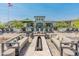 The community pool area is ready for relaxing with ample chairs, outdoor furniture, and a fire pit at 2121 W Sonoran Desert Dr # 14, Phoenix, AZ 85085