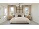 Comfortable bedroom featuring a padded headboard, coordinated nightstands, and ample closet space at 24971 N 167Th Dr, Surprise, AZ 85387