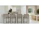 Modern kitchen with breakfast bar seating, stainless steel appliances, and a sleek, white design at 24971 N 167Th Dr, Surprise, AZ 85387