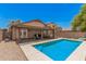 Backyard with a pristine pool, a covered patio, and a seating area, great for outdoor living at 2516 E San Manuel Rd, San Tan Valley, AZ 85143