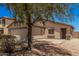 Charming single-story home with desert landscaping, an attached garage, and a cozy front porch entrance at 2516 E San Manuel Rd, San Tan Valley, AZ 85143