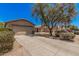 Front exterior of a single-story house with a well-maintained lawn, showing the driveway and surrounding desert landscape at 2516 E San Manuel Rd, San Tan Valley, AZ 85143