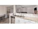 Modern kitchen featuring stainless steel appliances, double sink, white cabinets and a granite countertop at 2516 E San Manuel Rd, San Tan Valley, AZ 85143