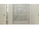 Bathroom featuring a glass shower with white marble surround and chrome hardware at 25233 N 177Th Dr, Surprise, AZ 85387