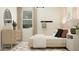 Stylish bedroom featuring a neutral color palette, patterned rug, and lots of natural light from the windows at 25233 N 177Th Dr, Surprise, AZ 85387