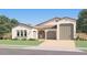 Charming single-story home with a stucco exterior, tile roof, and a two-car garage at 25233 N 177Th Dr, Surprise, AZ 85387