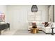 Bright living room featuring a white sectional sofa and patterned rug at 25233 N 177Th Dr, Surprise, AZ 85387