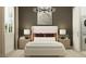Main bedroom with a modern lamp, accent pillows and natural light from the window at 25233 N 177Th Dr, Surprise, AZ 85387