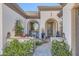 Beautiful porch with tiled walk-up, seating and desert landscaping at 25979 W Taro Dr, Buckeye, AZ 85396