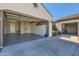 Spacious three car garage featuring epoxy floors and a full wall of built-in cabinets at 25979 W Taro Dr, Buckeye, AZ 85396