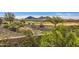 Picturesque view of the golf course and mountains behind this charming desert home at 25979 W Taro Dr, Buckeye, AZ 85396