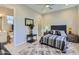 Comfortable bedroom with a neutral color scheme and an ensuite bathroom with double sink at 25979 W Taro Dr, Buckeye, AZ 85396
