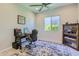 Inviting home office with modern desk, comfortable chair, and a decorative area rug for a cozy workspace at 25979 W Taro Dr, Buckeye, AZ 85396
