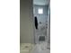 Modern shower features white marble, a rainfall shower head, and gray tiled floor for a sleek aesthetic at 25979 W Taro Dr, Buckeye, AZ 85396