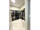 Spacious walk-in closet with custom shelving and clothing racks, offering ample storage for an organized wardrobe at 25979 W Taro Dr, Buckeye, AZ 85396