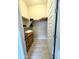 Walk-in closet featuring shelving and an adjacent wooden dresser at 25979 W Taro Dr, Buckeye, AZ 85396