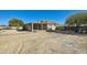 Spacious backyard showcasing a covered patio and ample land at 2602 S 226Th Dr, Buckeye, AZ 85326