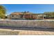 Lush backyard featuring a covered patio and mature greenery at 2602 S 226Th Dr, Buckeye, AZ 85326