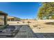 Large backyard with stone pathways and desert landscaping at 2602 S 226Th Dr, Buckeye, AZ 85326
