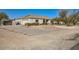 Single story home featuring an attached two-car garage and circular driveway at 2602 S 226Th Dr, Buckeye, AZ 85326
