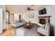Spacious living room with a fireplace, comfortable seating, and hardwood floors at 2602 S 226Th Dr, Buckeye, AZ 85326