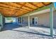 Relaxing covered patio with brick flooring and access to backyard at 2602 S 226Th Dr, Buckeye, AZ 85326