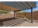 Covered back patio features brick pavers, planter, and privacy wall at 2670 E Bellerive Dr, Gilbert, AZ 85298