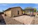 View of home's backyard showing patio, rock landscaping and exterior at 2670 E Bellerive Dr, Gilbert, AZ 85298