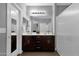 Bathroom showcasing a large mirror, double vanity, and a walk-in shower at 2670 E Bellerive Dr, Gilbert, AZ 85298
