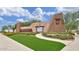 Community entrance featuring rock signage, landscaping and manicured lawn at 2670 E Bellerive Dr, Gilbert, AZ 85298