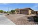 This house has a well manicured yard with decorative rock and a two car garage at 2670 E Bellerive Dr, Gilbert, AZ 85298