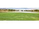 Scenic view of a community pond with water features and surrounding green space at 2670 E Bellerive Dr, Gilbert, AZ 85298